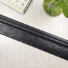 Black self-adhesive 3D wall trim line with ornate floral pattern for modern home decor