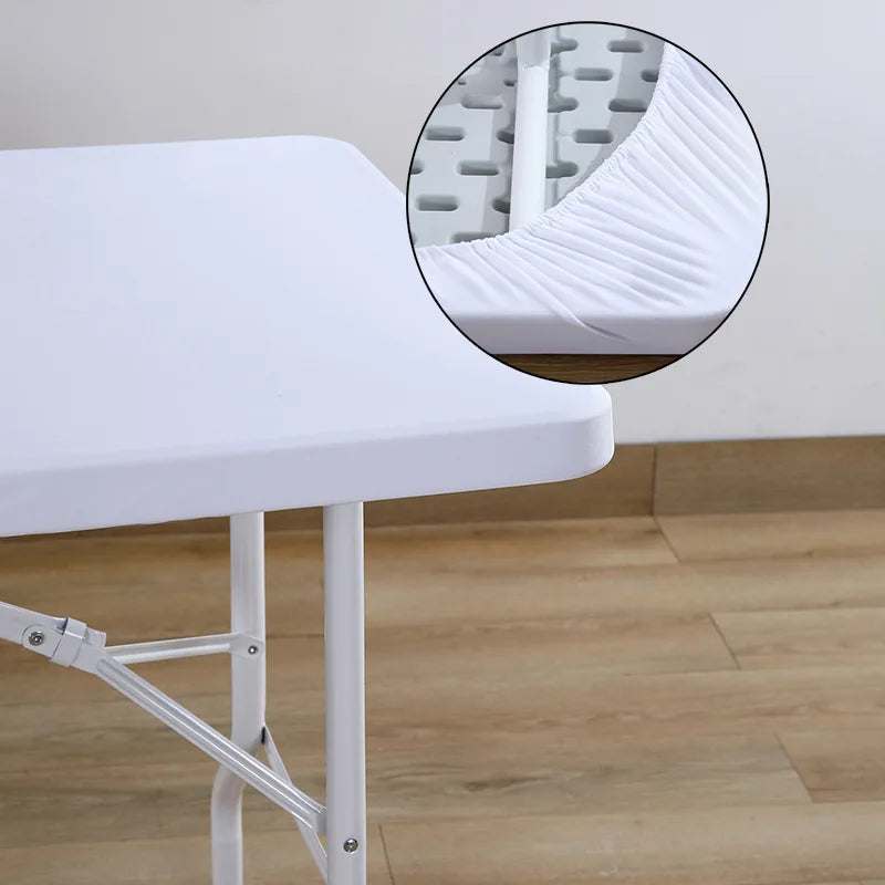 A white stretch elastic tablecloth cover is shown draped over a white table, with a close-up view of the fabric texture.