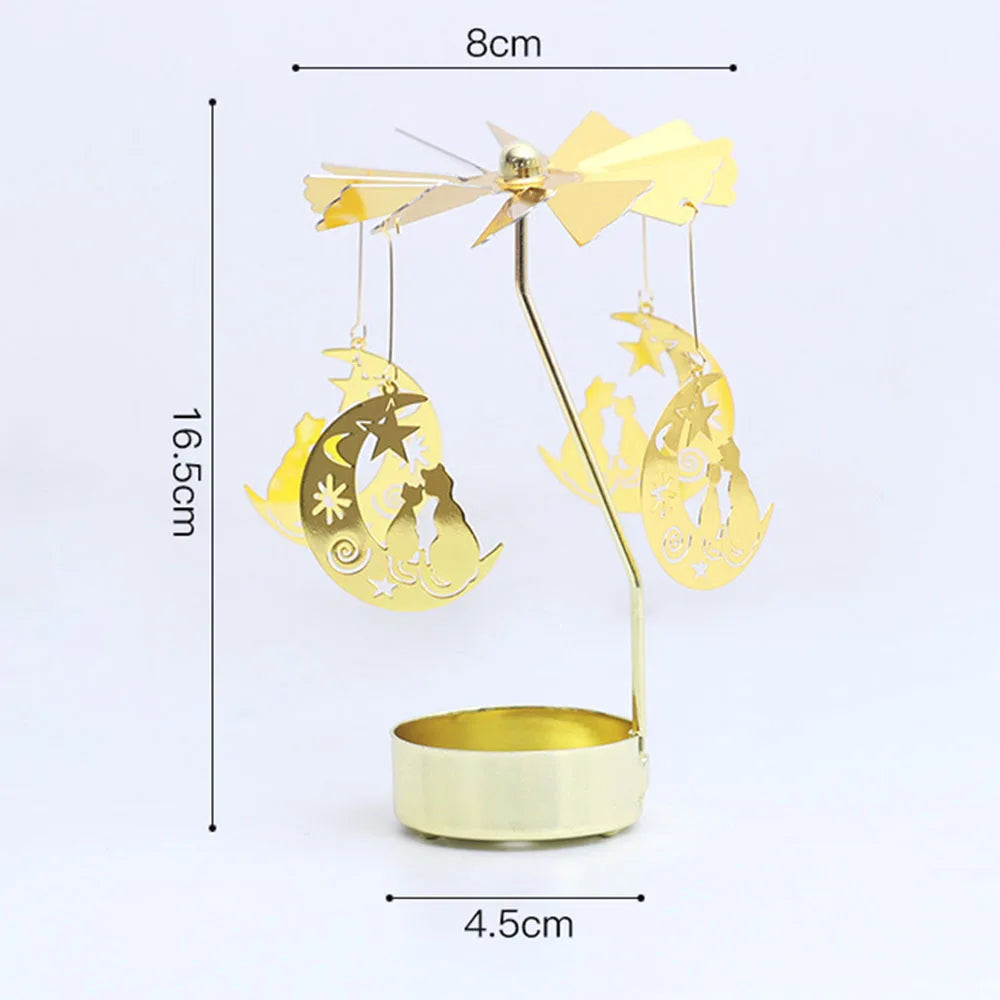 Gold rotating candle holder with a spinning carousel design and decorative stars and moons