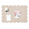 A light tan scalloped felt bulletin board with a cloud-shaped design featuring small cards and greenery.