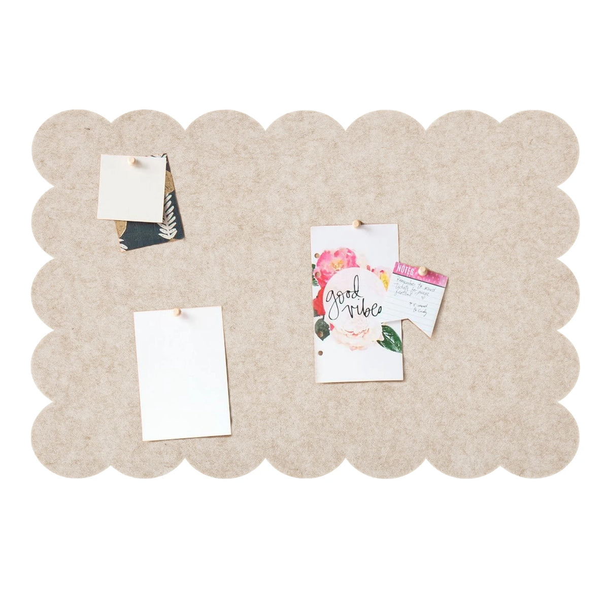 A light tan scalloped felt bulletin board with a cloud-shaped design featuring small cards and greenery.