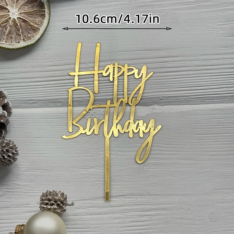 Gold acrylic birthday sign spelling out Happy Birthday on a light gray wooden background