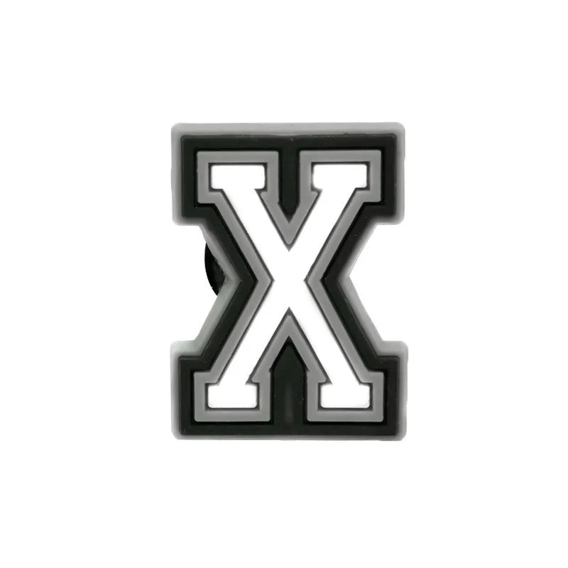 Charm ou accessoire de chaussure en lettre X noir et blanc.