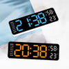 A digital wall clock displaying the time 2:38, temperature 58 degrees, and humidity percentage on a white background.