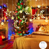 Star and moon LED string lights decorating a Christmas tree and fireplace in a cozy room