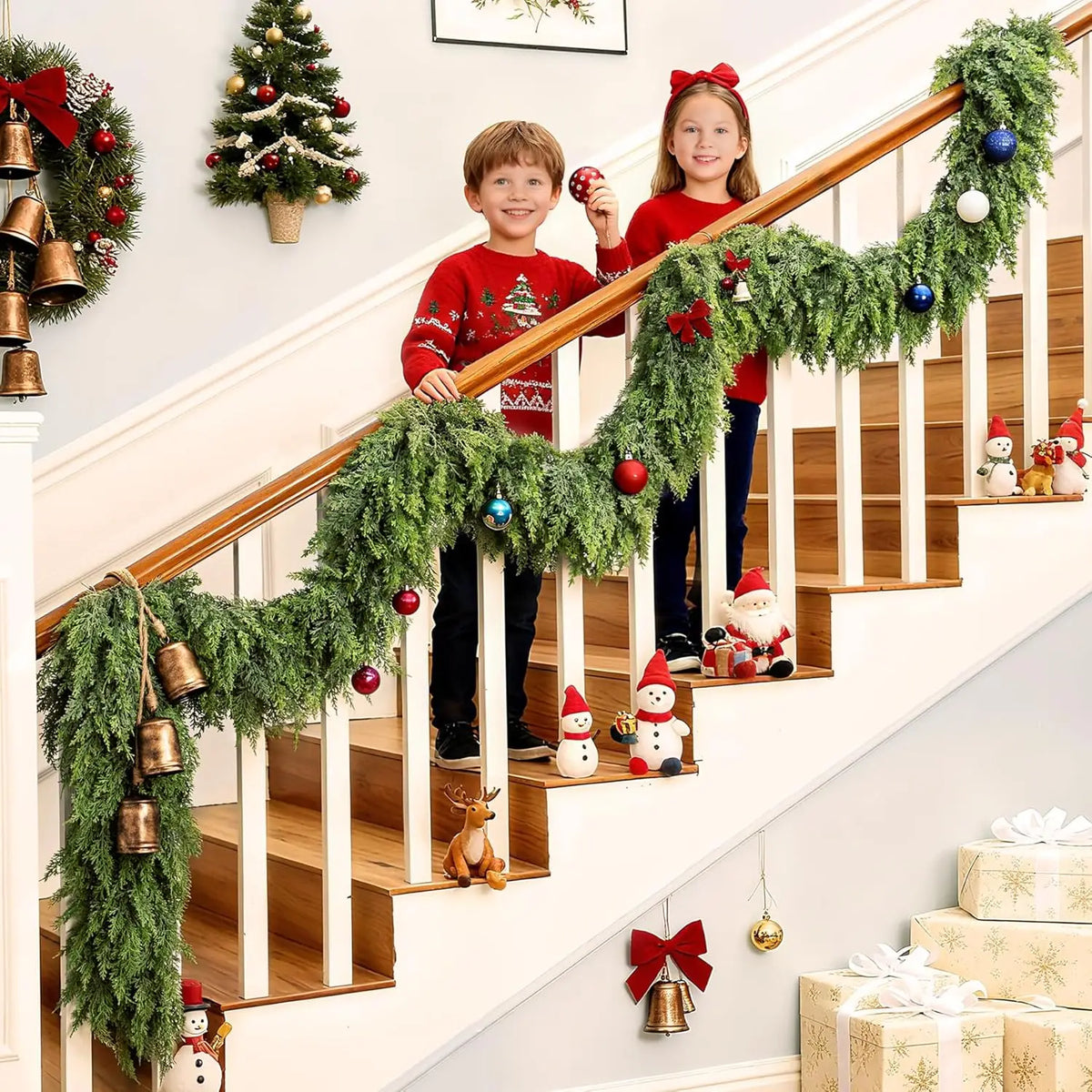 A festive Christmas scene featuring a wooden staircase decorated with a green cedar garland and children.
