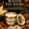 Evoduck Winter Toy Store vanilla amber cashmere scented candle in a gold tin with a gift box and card