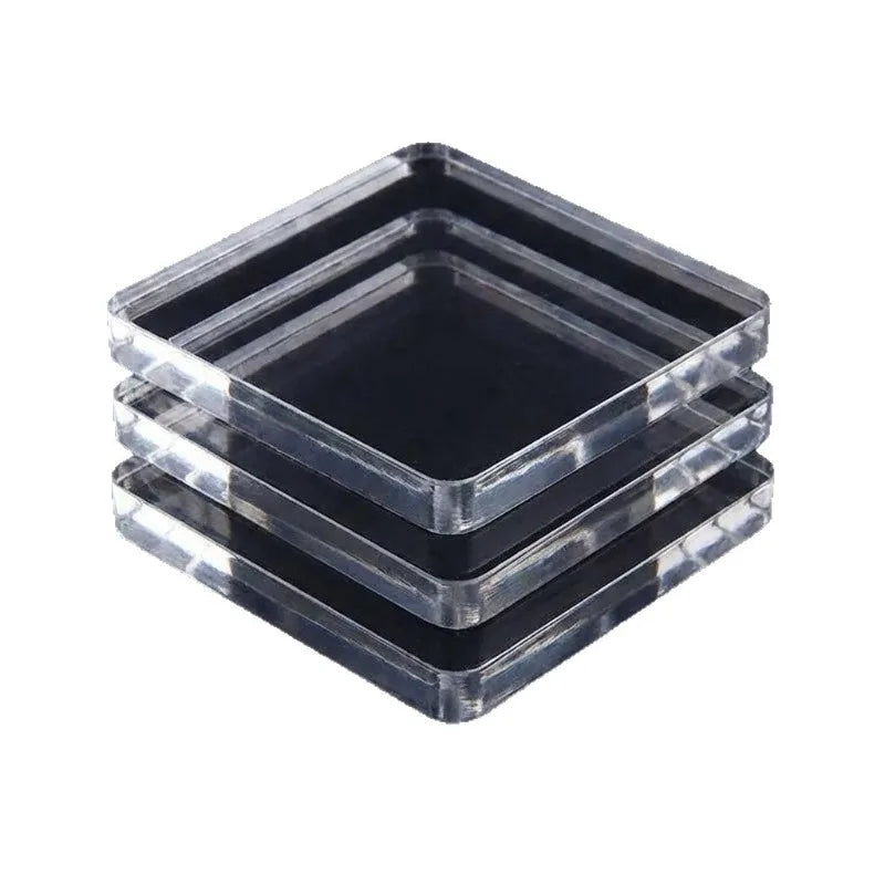 A stack of clear acrylic fridge magnet molds with square and rectangular shapes.