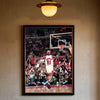 A framed photograph of Dennis Rodman playing basketball during a game.