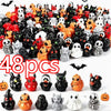 A collection of 48 mini resin Halloween duck figurines in various colors and designs for decoration.