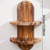 A set of geometric wooden wall shelves with a natural wood grain finish mounted on a white wall.