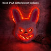 A glowing orange LED fox or rabbit face mask with fierce eyes against a dark background.