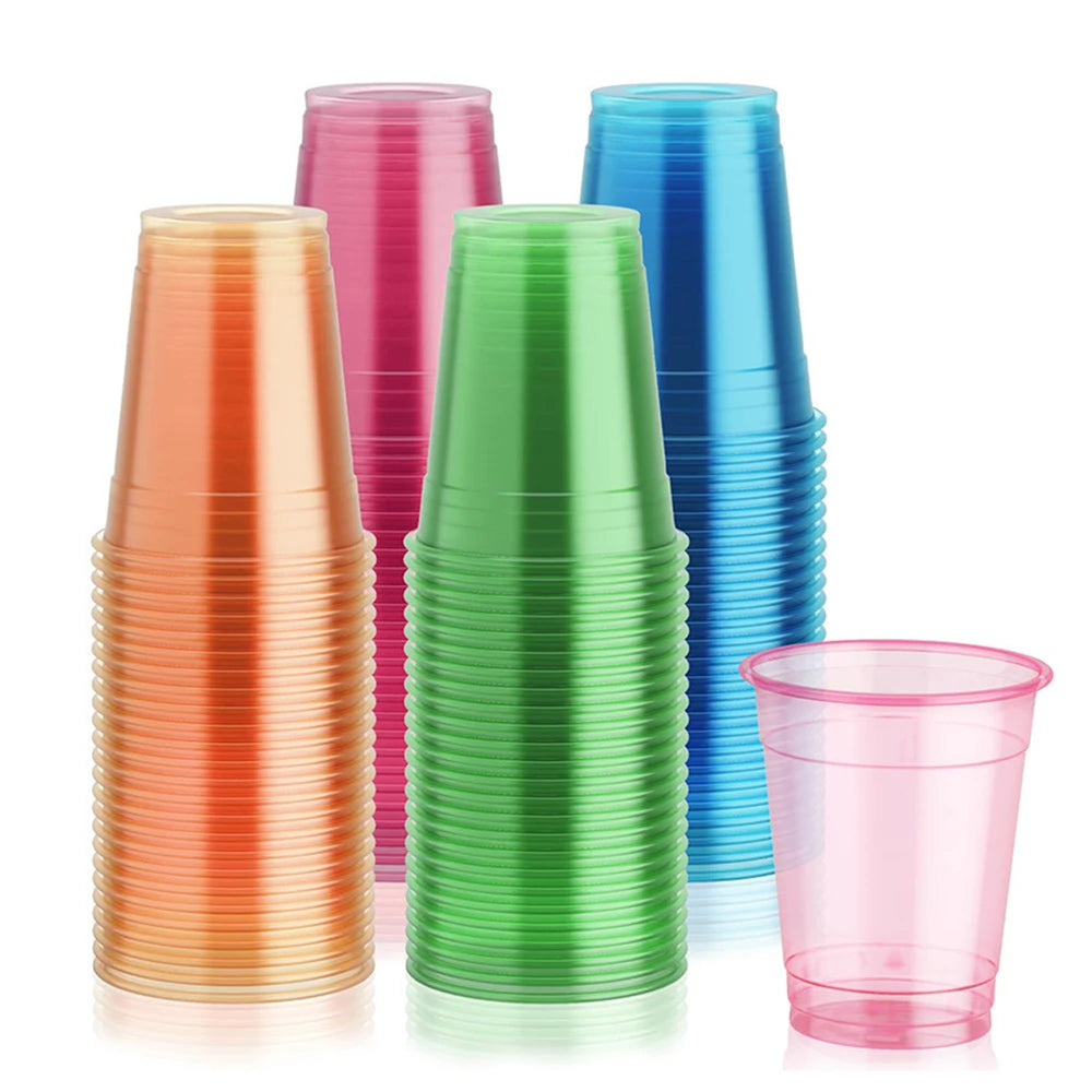 A collection of neon glow plastic party cups in various shades including pink, orange, green, and blue.