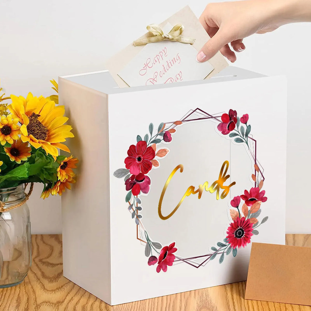 A white acrylic gift box with a lid featuring a gold wedding day card and floral designs.