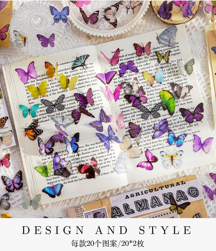A spread of butterfly art collage stickers and illustrations for scrapbooking on a page.