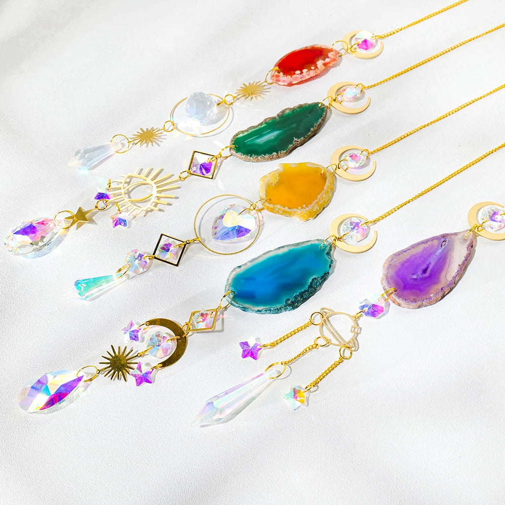 A collection of natural agate sun catcher crystals strung on gold wire, featuring various colors like red, green, yellow, blu
