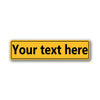 A yellow rectangular sign with the text Your text here on a white background.