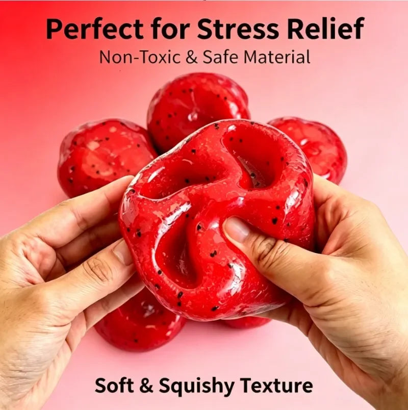 Hands hold a bright red watermelon slushy squishy fidget toy showing its soft and squishy texture.