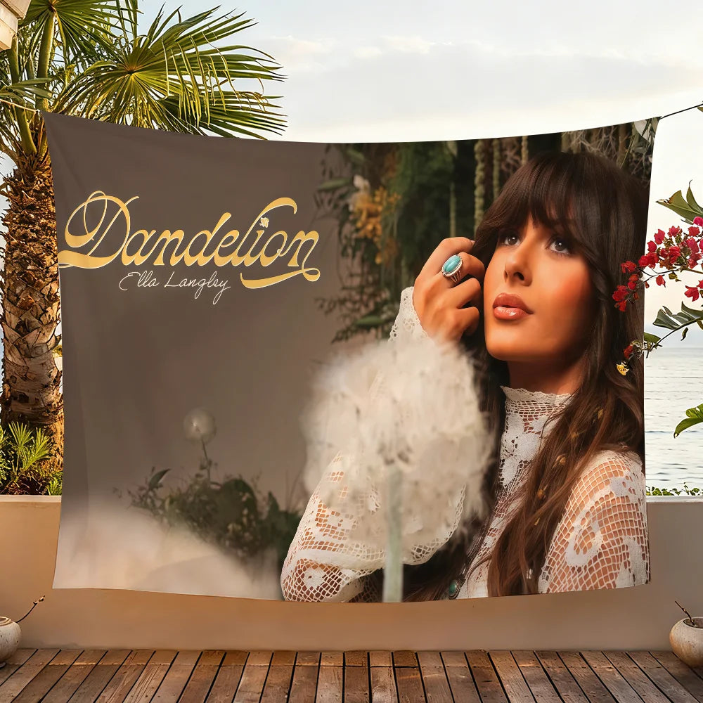 A tapestry wall hanging featuring a portrait of singer Ella Langley with flowing hair and floral elements.