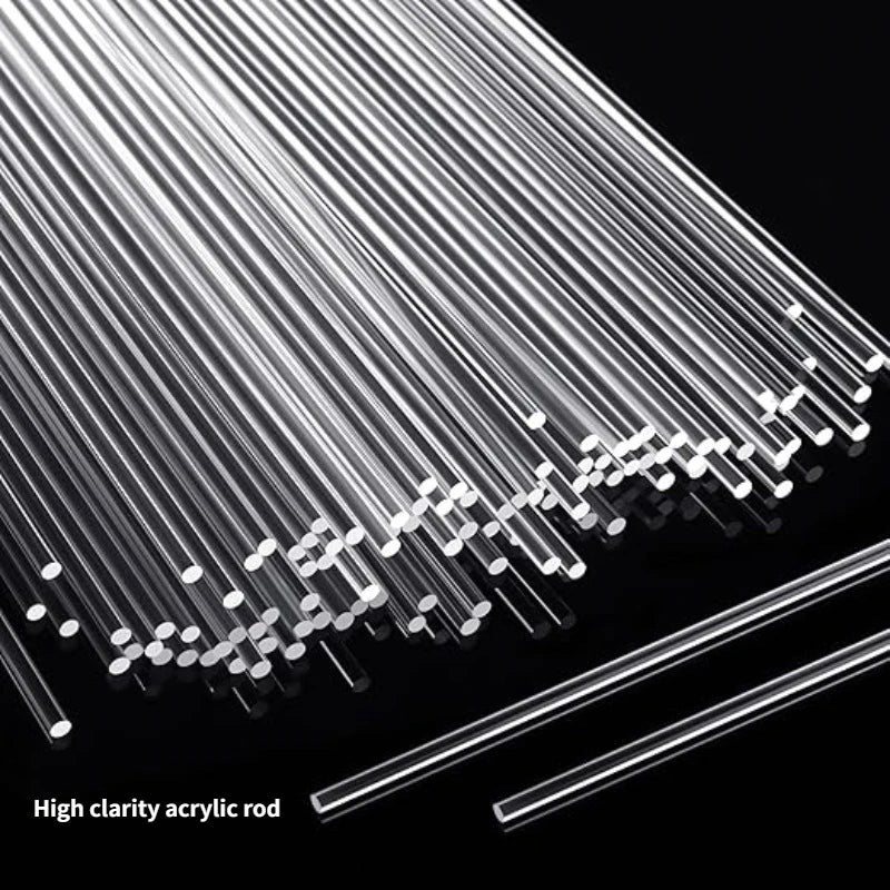 A close-up view of a set of clear acrylic rods or sticks arranged diagonally against a black background.
