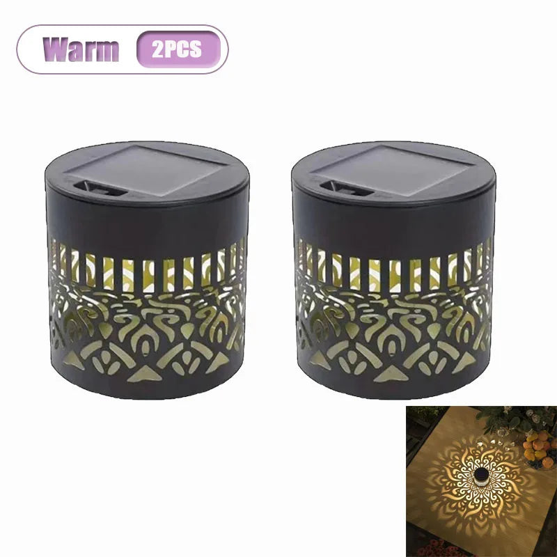 Two dark metal wall lanterns with intricate golden mandala patterns for garden and patio lighting