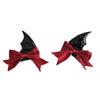A set of black devil horn and bat wing hair clips with red satin bows.