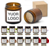 A collection of small glass jars containing scented soy wax candles with various labels like Jasmine, Wild Bluebell, and Rose