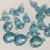 A collection of translucent blue glow in the dark resin sea animal figurines.