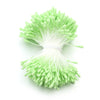 A cluster of bright lime green artificial flower stamens or pistils used for DIY decoration.