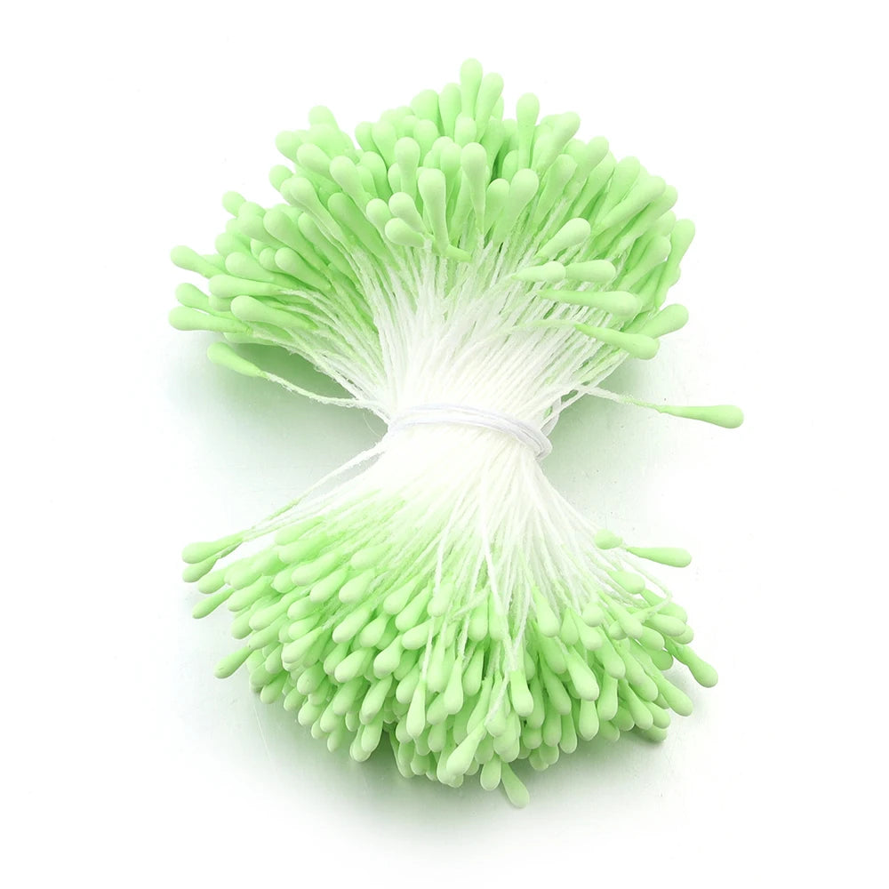 A cluster of bright lime green artificial flower stamens or pistils used for DIY decoration.