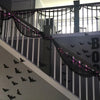 Black gauze netting draped across a balcony railing for spooky party decor
