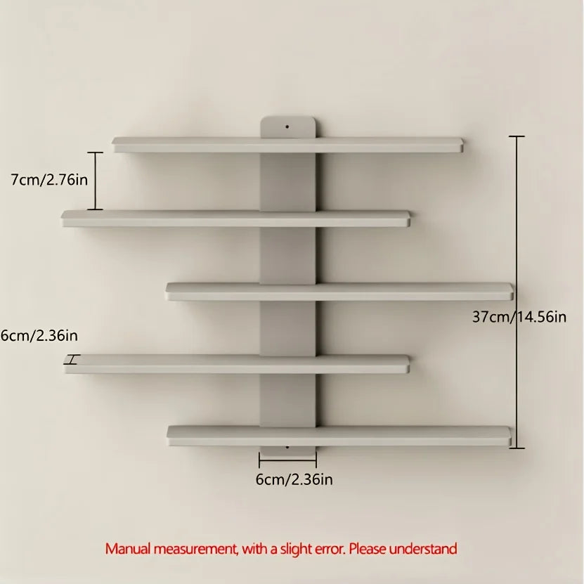 A set of four gray floating wall shelves mounted on a white wall, showing various dimensions.