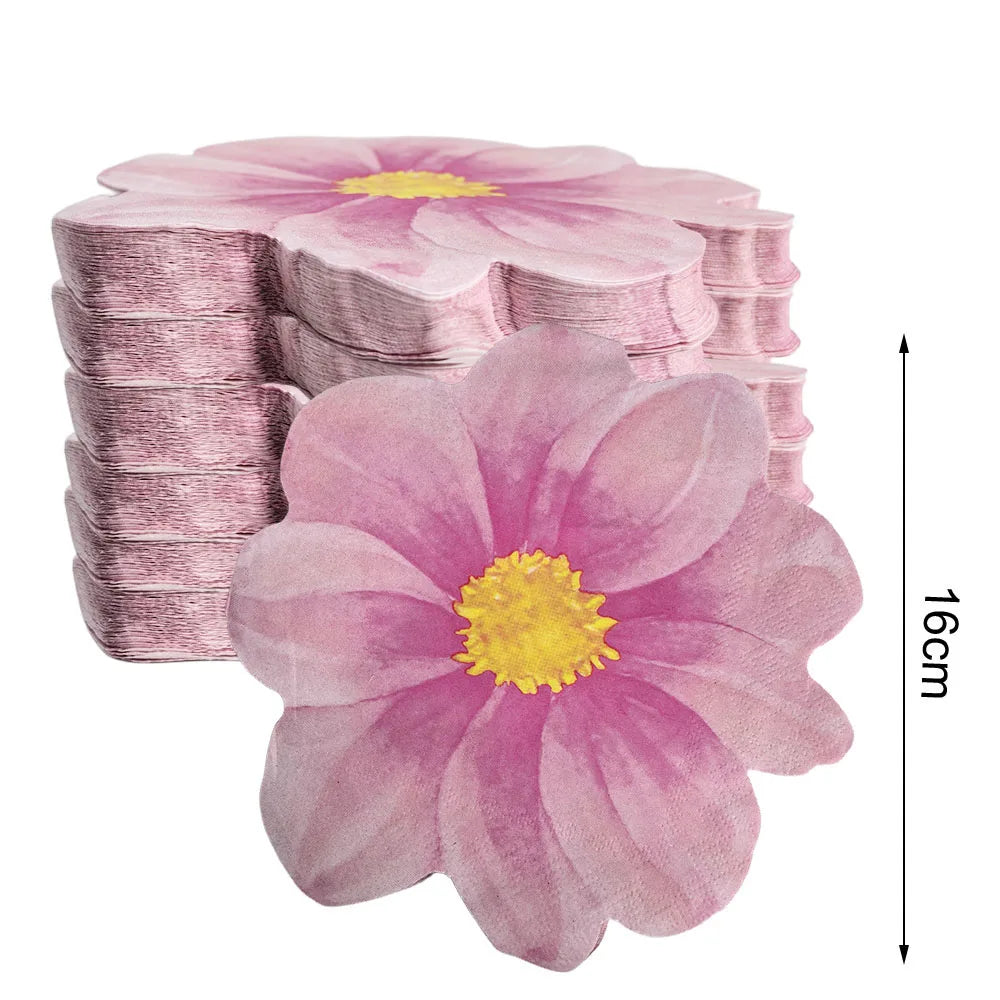 A stack of disposable pink daisy flower napkins with a measurement scale.