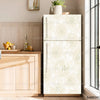 A modern, light beige refrigerator with a floral pattern is displayed next to a wooden cabinet and a window.