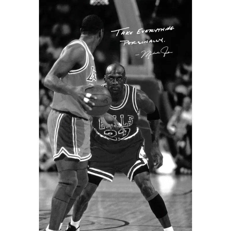 Black and white photo of a basketball player in a uniform during a game.