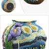 A colorful resin vase featuring swirling blue and yellow patterns resembling a starry night sky.