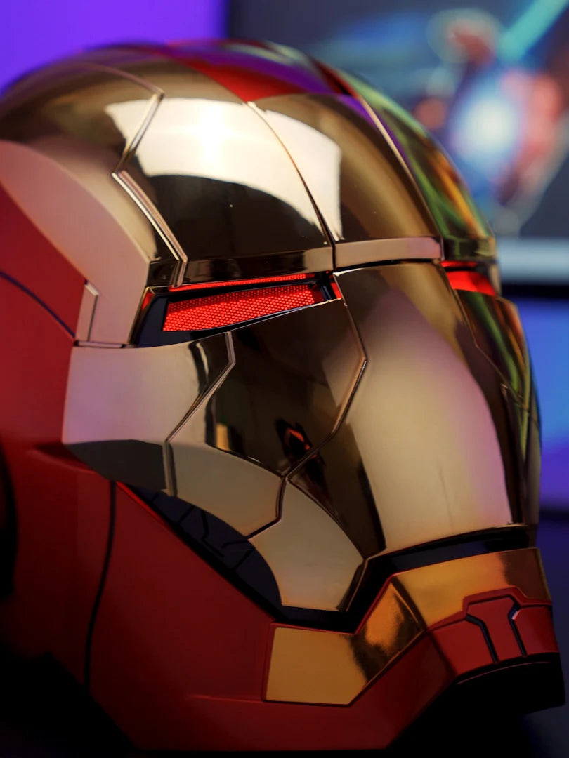 Close-up of a metallic red and gold Iron Man MK5 wearable helmet with glowing red LED lights.