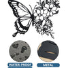 Black metal butterfly wall decor featuring a detailed floral pattern.