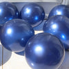 A collection of shiny navy blue balloons with metallic and pearl finishes.