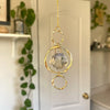Pendentif en verre ovale avec décoration de soleil en cristal ton or