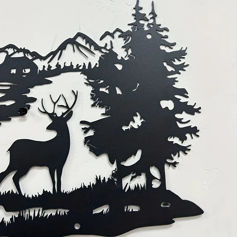 Black silhouette wall art featuring a deer standing in front of a dense forest and mountain backdrop.