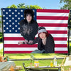 A photo of Jake Webber and Johnnie Guilbert tapestry wall hanging displayed on an American flag backdrop.