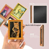 A hand holds a framed vintage cat hug fridge magnet showing a tabby cat and kitten.