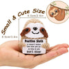 A handmade crochet sloth potato doll with a positive inspirational card held in a hand.