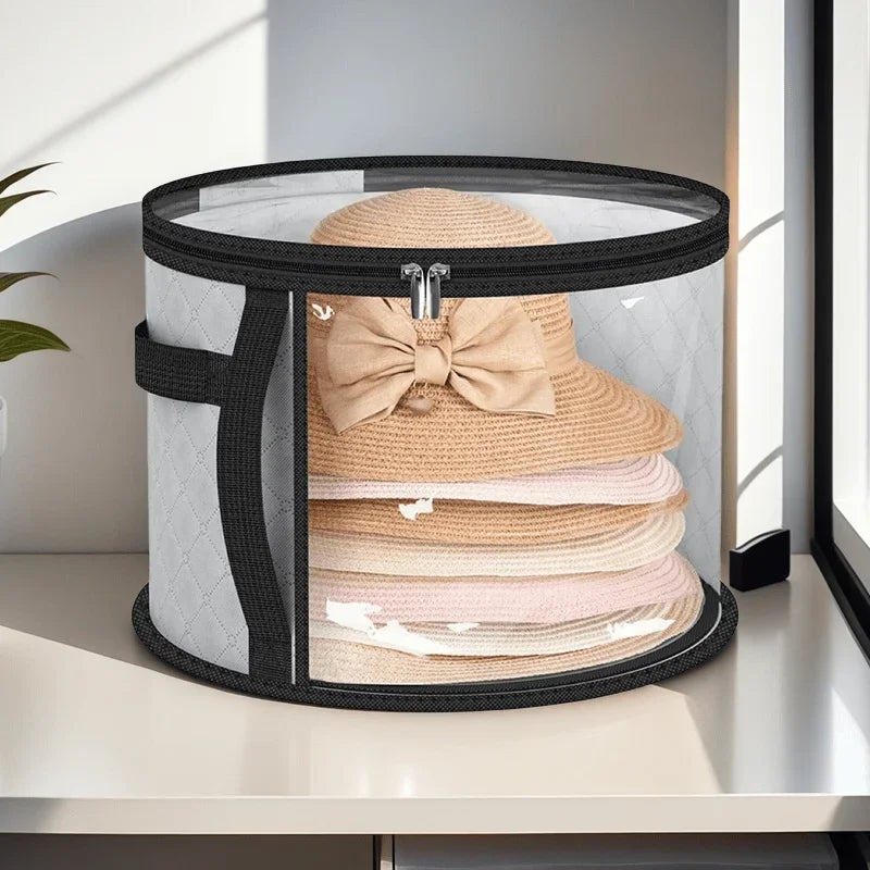 An extra-large foldable hat storage box with a clear viewing window, holding several light pink and beige knitted hats.