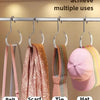 Various hangings like belts, scarves, ties, and hats displayed on a metal rack for multiple uses