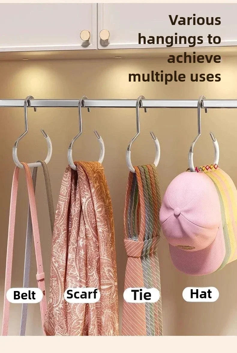 Various hangings like belts, scarves, ties, and hats displayed on a metal rack for multiple uses