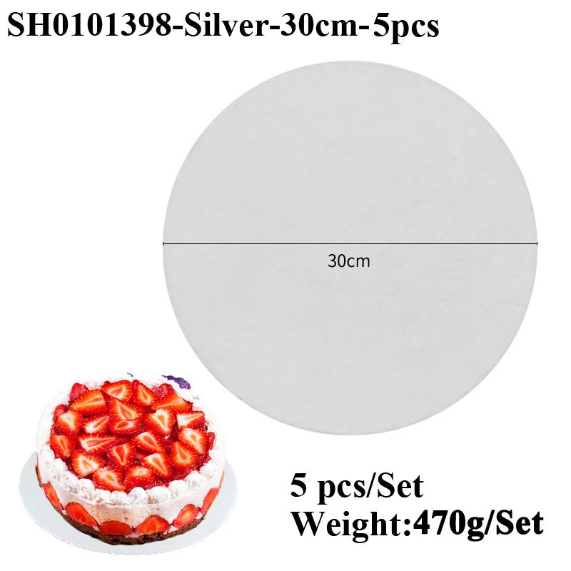 A round silver coated cake board with a 30cm diameter is shown next to five strawberry-topped cakes.