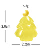 A small yellow resin charm shaped like a Christmas tree with a gold topper.