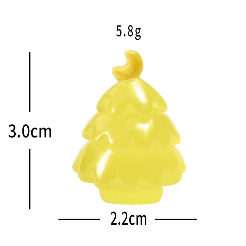 A small yellow resin charm shaped like a Christmas tree with a gold topper.